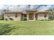One-story house with a copper roof and landscaped lawn at 6930 69Th E St, Palmetto, FL 34221