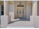 Inviting front entry with columns and a decorative door at 6930 69Th E St, Palmetto, FL 34221