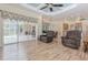 Living room features hardwood floors and a view of the pool at 6930 69Th E St, Palmetto, FL 34221