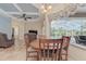 Bright dining area with wood table and chairs, overlooking the pool at 6930 69Th E St, Palmetto, FL 34221