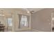 Spacious living area with large windows and ceiling fan at 6930 69Th E St, Palmetto, FL 34221