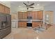 Modern kitchen with stainless steel appliances and wood cabinets at 6930 69Th E St, Palmetto, FL 34221