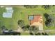 Aerial view of home with pool and detached garage at 6930 69Th E St, Palmetto, FL 34221