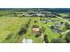 Aerial view of property with multiple homes and open space at 6930 69Th E St, Palmetto, FL 34221