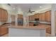 Modern kitchen with wood cabinets and a large island at 6930 69Th E St, Palmetto, FL 34221