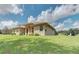 One-story house with a copper roof and expansive lawn at 6930 69Th E St, Palmetto, FL 34221