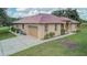 Single-story home with attached garage and mature landscaping at 6930 69Th E St, Palmetto, FL 34221
