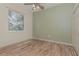 Bright bedroom with wood floors, neutral walls, and large window at 6930 69Th E St, Palmetto, FL 34221