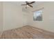 Light and airy bedroom with wood floors and a ceiling fan at 6930 69Th E St, Palmetto, FL 34221