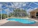 Large kidney-shaped pool with screened enclosure at 6930 69Th E St, Palmetto, FL 34221