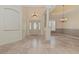 Spacious entryway with tile floors and elegant light fixtures at 6930 69Th E St, Palmetto, FL 34221