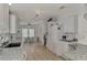 Bright kitchen, granite counters, white cabinets, and breakfast nook at 634 Schooner St, North Port, FL 34287