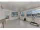Sunroom with tile floor, windows, and exercise equipment at 634 Schooner St, North Port, FL 34287