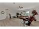 Spacious living room featuring a sofa, recliner, and large windows at 634 Schooner St, North Port, FL 34287