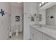 Bathroom with toilet, shower, and single sink vanity at 634 Schooner St, North Port, FL 34287