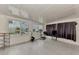 Bright sunroom with tile flooring, windows, and exercise equipment at 634 Schooner St, North Port, FL 34287