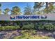 Harbor Isles community entrance sign with landscaping at 634 Schooner St, North Port, FL 34287