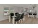 Open concept dining area with view of living room and kitchen at 634 Schooner St, North Port, FL 34287