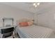 Bedroom with double bed, nightstand, and mirrored closet doors at 634 Schooner St, North Port, FL 34287