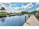 Community dock with several boats and access to waterway at 634 Schooner St, North Port, FL 34287