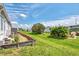 Landscaped backyard with grassy area and wooden border at 634 Schooner St, North Port, FL 34287