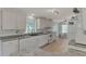White kitchen with granite countertops and ample cabinet space at 634 Schooner St, North Port, FL 34287