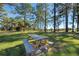 Relaxing picnic table in a grassy area with trees at 634 Schooner St, North Port, FL 34287