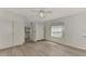 Bright bedroom with double bed, built-in closets, and wood-look flooring at 634 Schooner St, North Port, FL 34287
