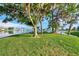 Scenic lakeside spot with picnic tables under lush trees at 634 Schooner St, North Port, FL 34287