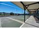 Community shuffleboard courts with covered seating at 634 Schooner St, North Port, FL 34287