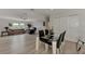 Living room with sofa, recliner, and adjacent dining area at 634 Schooner St, North Port, FL 34287