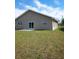 Rear view of house with sliding glass doors at 272 Albatross Rd, Rotonda West, FL 33947