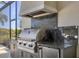 Stainless steel built-in grill with granite countertop at 7928 Mainsail Ln, Sarasota, FL 34240