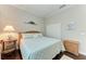 Guest bedroom with queen-size bed and wood floors at 12715 Lake Silver Ave, Bradenton, FL 34211
