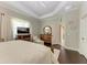 Serene main bedroom with a king-size bed and access to the bathroom at 12715 Lake Silver Ave, Bradenton, FL 34211