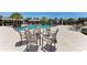 Resort-style pool area with chairs and tables for relaxing at 12715 Lake Silver Ave, Bradenton, FL 34211