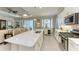 Open concept kitchen with island, stainless steel appliances, and white cabinets at 12715 Lake Silver Ave, Bradenton, FL 34211