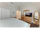 Bright bedroom with large bed and en-suite bathroom at 12715 Lake Silver Ave, Bradenton, FL 34211