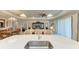 Large kitchen island with sink and seating, perfect for entertaining at 12715 Lake Silver Ave, Bradenton, FL 34211