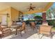 Relaxing outdoor patio area with tables, chairs, and a grilling station at 12715 Lake Silver Ave, Bradenton, FL 34211