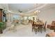 Open concept living and dining area with neutral color scheme at 12715 Lake Silver Ave, Bradenton, FL 34211