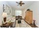 Relaxing office with a sofa, wood cabinet, and decorative items at 12715 Lake Silver Ave, Bradenton, FL 34211