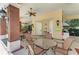 Outdoor community room with tables, ceiling fan, and grilling station at 12715 Lake Silver Ave, Bradenton, FL 34211
