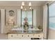 Bright kitchen island with stainless steel countertop and white cabinets at 12715 Lake Silver Ave, Bradenton, FL 34211