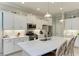 Spacious kitchen with white cabinets, stainless steel appliances, and a large island at 12715 Lake Silver Ave, Bradenton, FL 34211
