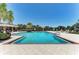 Relaxing community pool area with lounge chairs and a gazebo at 12715 Lake Silver Ave, Bradenton, FL 34211
