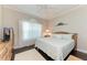 Spacious bedroom with king-size bed and dark wood floors at 12715 Lake Silver Ave, Bradenton, FL 34211