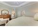 Luxurious main bedroom with ample space and views into the living area at 12715 Lake Silver Ave, Bradenton, FL 34211