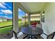 Relaxing screened porch with patio table and seating at 12715 Lake Silver Ave, Bradenton, FL 34211
