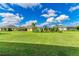 Large backyard with grassy area and neighboring homes at 12715 Lake Silver Ave, Bradenton, FL 34211